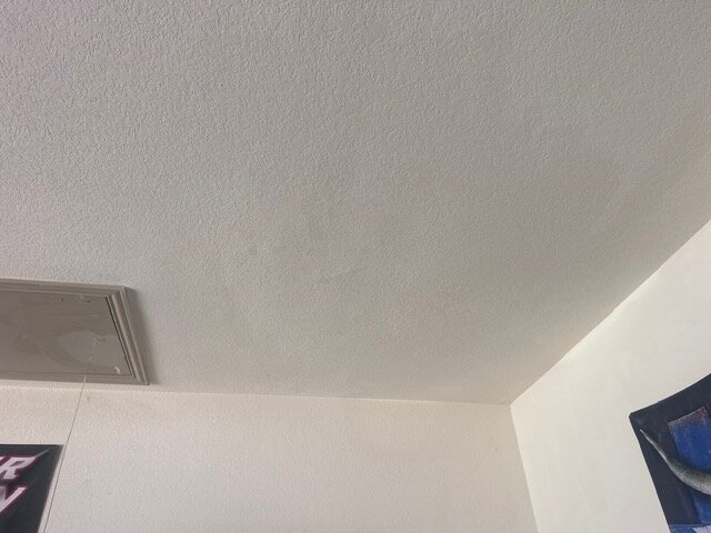 Finished drywall repair blended into ceiling texture